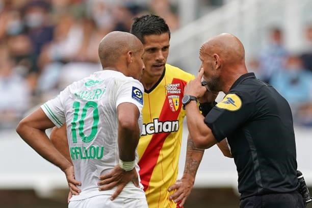 Wahbi Khazri of AS St-Etienne? Florian Sotoca of RC Lens and referee Amaury Delerue during the Ligue 1 Uber Eats match between RC Lens and AS Saint...