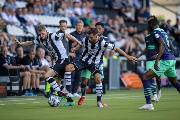 Phillipp Mwene of PSV Eindhoven and Nikolai Laursen of Heracles Almelo Battle for the ball during the Dutch Eredivisie match between Heracles Almelo...