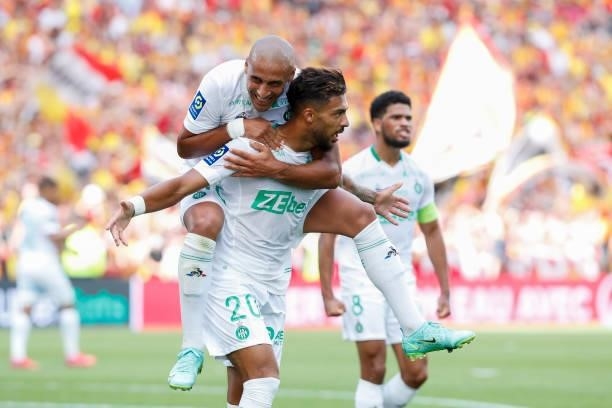 Denis Bouanga of AS Saint-Etienne celebrates his goal with Wahbi Khazri of AS Saint-Etienne during the Ligue 1 Uber Eats match between Lens and Saint...