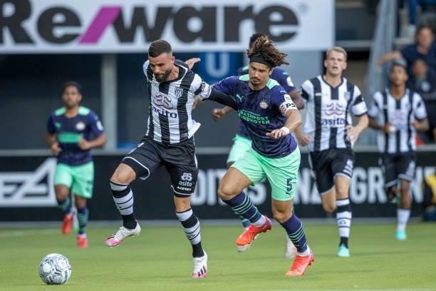 Rai Vloet of Heracles Almelo and Andre Ramalho of PSV Eindhoven Battle for the ball during the Dutch Eredivisie match between Heracles Almelo and PSV...