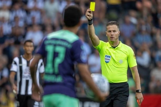 Referee Danny Makkelie shows yellow card to Mauro Junior of PSV Eindhoven during the Dutch Eredivisie match between Heracles Almelo and PSV Eindhoven...