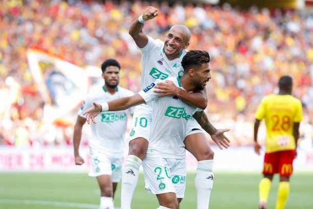 Denis Bouanga of AS Saint-Etienne celebrates his goal with Wahbi Khazri of AS Saint-Etienne during the Ligue 1 Uber Eats match between Lens and Saint...