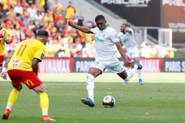 Zaydou Youssouf of AS Saint-Etienne shoots the ball against Jonathan Clauss of RC Lens during the Ligue 1 Uber Eats match between Lens and Saint...
