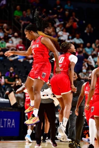 Aari McDonald and Odyssey Sims of the Atlanta Dream celebrate during the game against the Phoenix Mercury on August 15, 2021 at Footprint Center in...