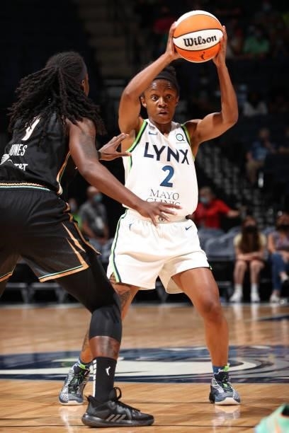 Crystal Dangerfield of the Minnesota Lynx handles the ball during the game against the New York Liberty on August 15, 2021 at Target Center in...
