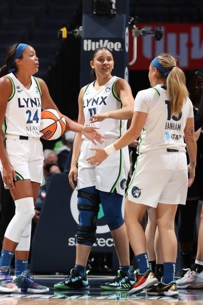 Natalie Achonwa hi-fives Napheesa Collier and Rachel Banham of the Minnesota Lynx during the game against the New York Liberty on August 15, 2021 at...