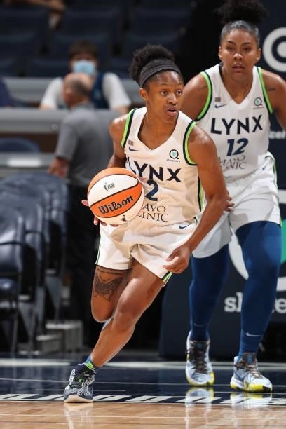 Crystal Dangerfield of the Minnesota Lynx dribbles the ball during the game against the New York Liberty on August 15, 2021 at Target Center in...