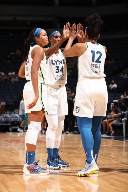 Sylvia Fowles hi-fives Damiris Dantas of the Minnesota Lynx during the game against the New York Liberty on August 15, 2021 at Target Center in...