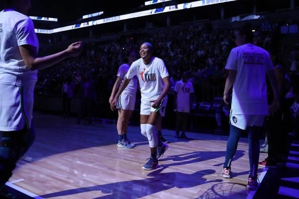 Napheesa Collier of the Minnesota Lynx hi-fives teammates before the game against the New York Liberty on August 15, 2021 at Target Center in...