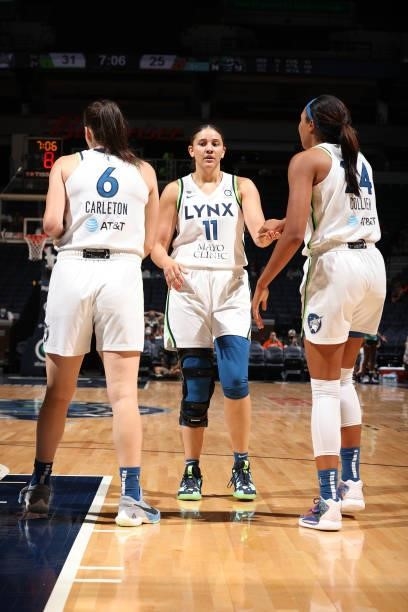 Natalie Achonwa hi-fives Bridget Carleton and Napheesa Collier of the Minnesota Lynx during the game against the New York Liberty on August 15, 2021...