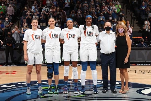 Owner, Glen Taylor of the Minnesota Lynx and wife Becky Mulvihill pose for a photo with Olympians, Bridget Carleton, Natalie Achonwa, Napheesa...
