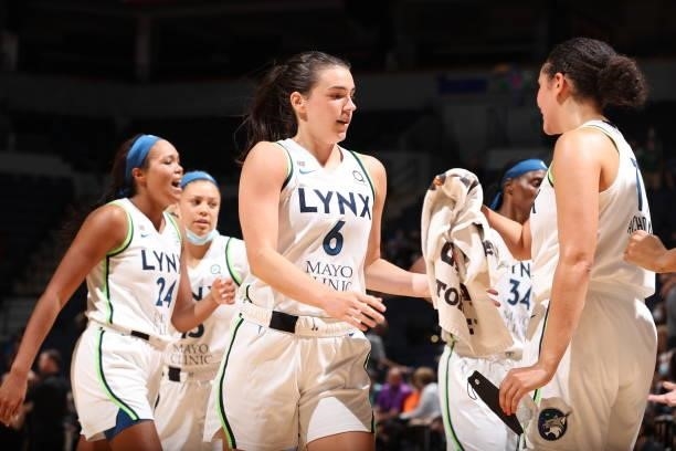 Bridget Carleton of the Minnesota Lynx hi-fives teammates during the game against the New York Liberty on August 15, 2021 at Target Center in...