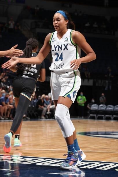 Napheesa Collier of the Minnesota Lynx hi-fives teammates during the game against the New York Liberty on August 15, 2021 at Target Center in...