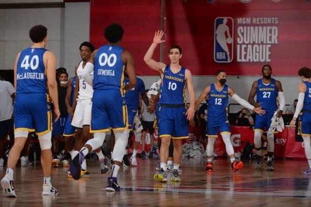 Justinian Jessup of the Golden State Warriors high fives Jonathan Kuminga of the Golden State Warriors during the 2021 Las Vegas Summer League on...