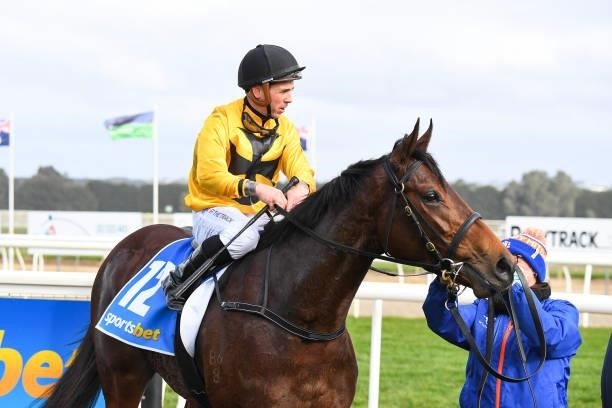 Star Of Chaos ridden by Dean Holland returns to the mounting yard after winning the Porter Plant Fillies and Mares Maiden Plate at Sportsbet-Ballarat...