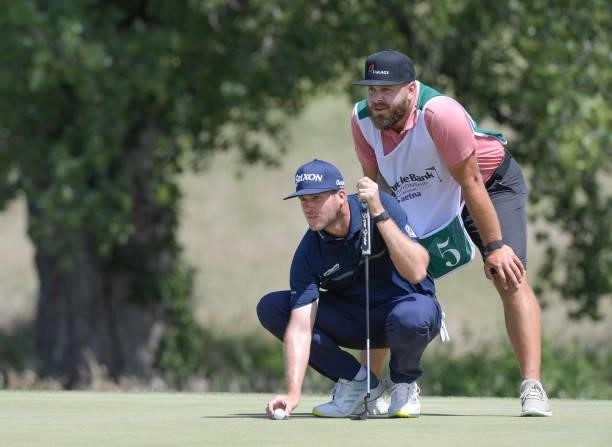Taylor Pendrith lines his putt on the first hole during the final round of the Korn Ferry Tours Pinnacle Bank Championship presented by Aetna at The...