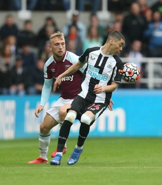 Newcastle United's Miguel Almiron and West Ham United's Jarrod Bowen during the Premier League match between Newcastle United and West Ham United at...