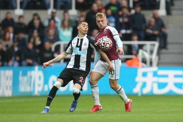 Newcastle United's Miguel Almiron and West Ham United's Jarrod Bowen during the Premier League match between Newcastle United and West Ham United at...