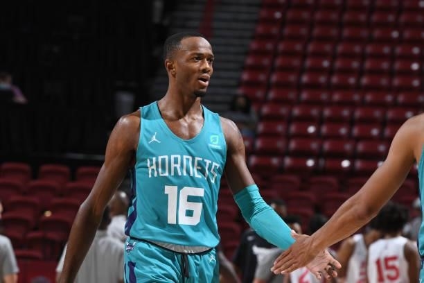 Scottie Lewis of Charlotte Hornets high fives teammate during the game against the Chicago Bulls during the 2021 Las Vegas Summer League on August...
