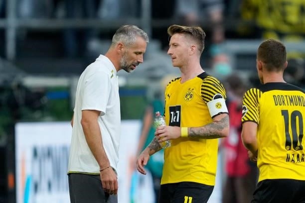 Head coach Marco Rose of Borussia Dortmund talks to Marco Reus of Borussia Dortmund during the Bundesliga match between Borussia Dortmund and...