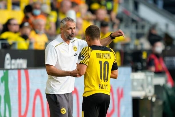 Head coach Marco Rose of Borussia Dortmund talks to Thorgan Hazard of Borussia Dortmund during the Bundesliga match between Borussia Dortmund and...