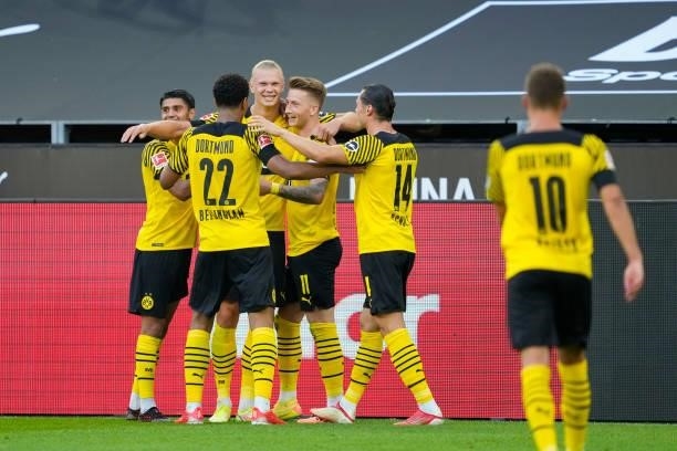 Erling Haaland of Borussia Dortmund celebrates after scoring his team's third goal with teammates during the Bundesliga match between Borussia...