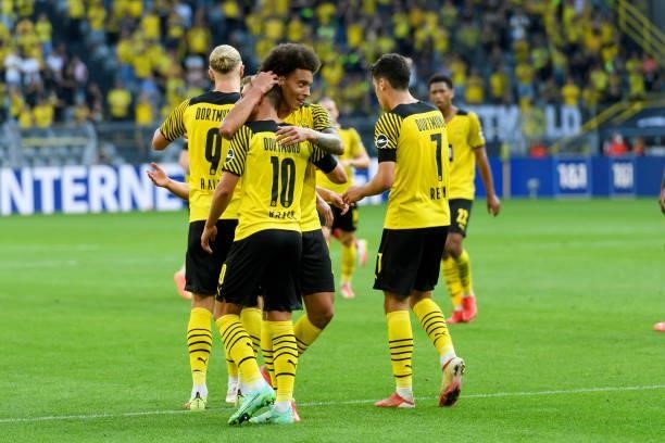 Thorgan Hazard of Borussia Dortmund celebrates after scoring his team's second goal with teammates during the Bundesliga match between Borussia...
