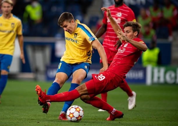 Mikael Uhre of Broendby scores his team's first goal next to Maximilian Woeber of Salzburg during the UEFA Champions League Play-Offs Leg One match...