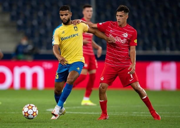 Anis Ben Slimane of Broendby in action with Nicolas Capaldo of Salzburg during the UEFA Champions League Play-Offs Leg One match between FC Red Bull...