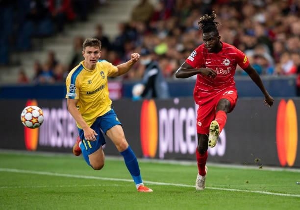 Oumar Solet of Salzburg in action with Mikael Uhre of Broendby during the UEFA Champions League Play-Offs Leg One match between FC Red Bull Salzburg...