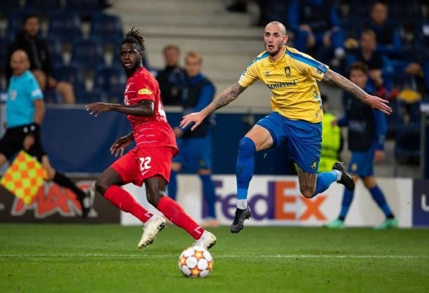 Oumar Solet of Salzburg in action with Jens Martin Gammelby of Broendby during the UEFA Champions League Play-Offs Leg One match between FC Red Bull...
