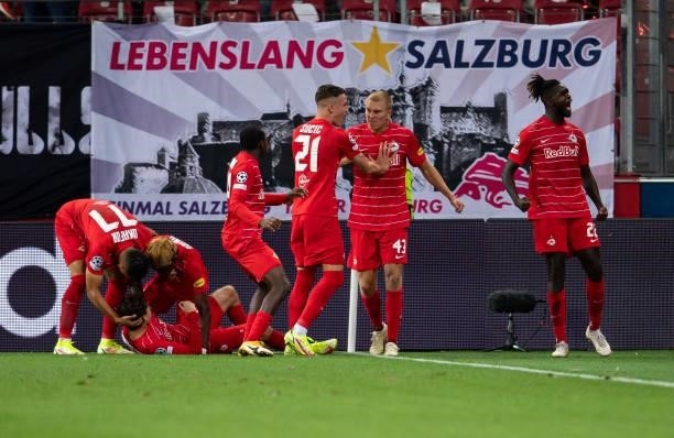 Brenden Aaronson of Salzburg celebrates his team's second goal with teammates during the UEFA Champions League Play-Offs Leg One match between FC Red...