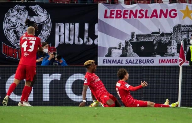 Brenden Aaronson of Salzburg celebrates his team's second goal with teammates during the UEFA Champions League Play-Offs Leg One match between FC Red...