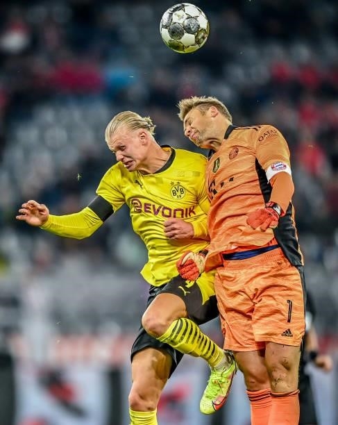 Erling Haaland of Dortmund in action with Manuel Neuer of München during the Supercup 2021 match between FC Bayern München and Borussia Dortmund at...