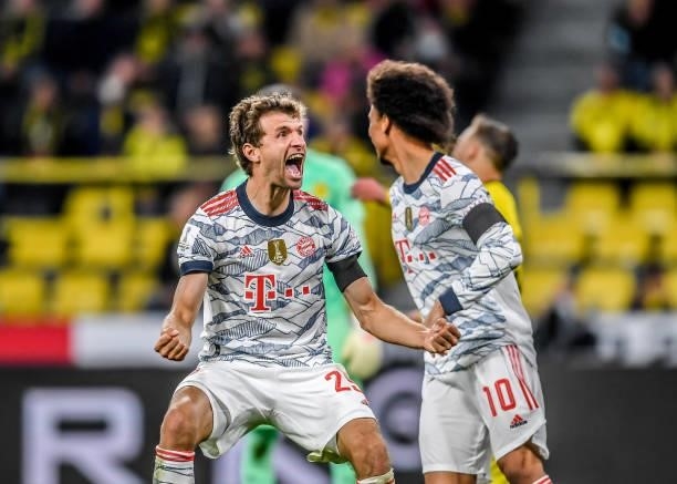 Thomas Mueller of München celebrates with Leroy Sane after scoring his team's second goal during the Supercup 2021 match between FC Bayern München...