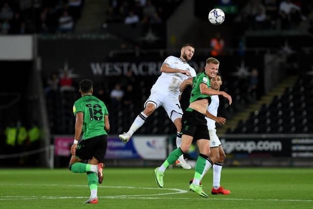 Brandon Cooper of Swansea City battles with Sam Surridge of Stoke City during the Sky Bet Championship match between Swansea City and Stoke City at...