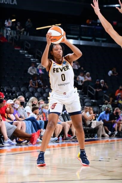 Kelsey Mitchell of the Indiana Fever looks to pass the ball during the game against the Phoenix Mercury on August 17, 2021 at Footprint Center in...