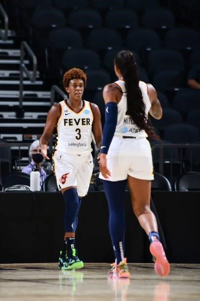 Danielle Robinson of the Indiana Fever high fives Tiffany Mitchell of the Indiana Fever during the game against the Phoenix Mercury on August 17,...