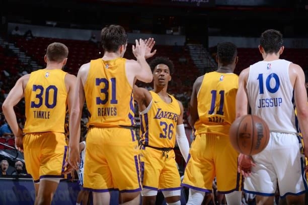 Austin Reaves high fives Jordan Floyd of the Los Angeles Lakers during the game against the Golden State Warriors during the 2021 Las Vegas Summer...