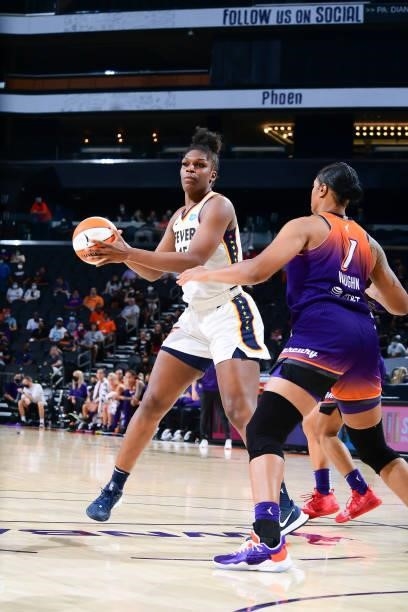 Teaira McCowan of the Indiana Fever handles the ball during the game against the Phoenix Mercury on August 17, 2021 at Footprint Center in Phoenix,...