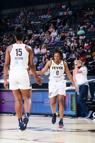 Teaira McCowan of the Indiana Fever high fives Kelsey Mitchell of the Indiana Fever during the game against the Phoenix Mercury on August 17, 2021 at...