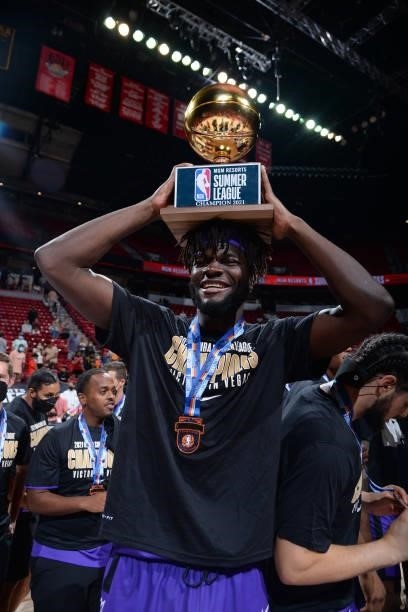 Neemias Queta of the Sacramento Kings celebrates with the MGM Resorts 2021 Summer League Championship Trophy after winning the 2021 Las Vegas Summer...