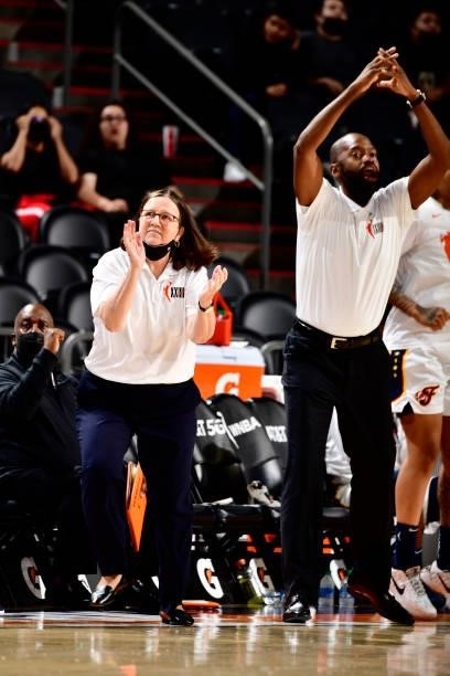 Head Coach Marianne Stanley and Assistant Coach Jhared Simpson celebrate during the game against the Phoenix Mercury on August 17, 2021 at Footprint...