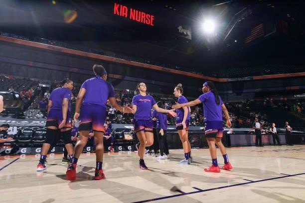 Kia Nurse of the Phoenix Mercury high fives her teammates before the game against the Indiana Fever on August 17, 2021 at Footprint Center in...