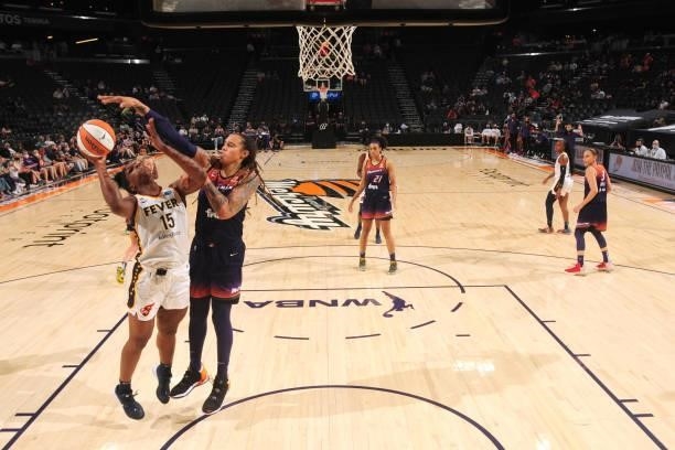 Brittney Griner of the Phoenix Mercury reaches to block a shot by Teaira McCowan of the Indiana Fever during the game on August 17, 2021 at Footprint...