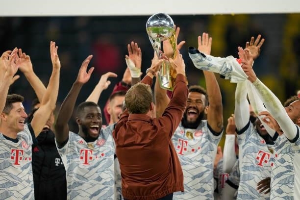 Head coach Julian Nagelsmann of Bayern Muenchen lifts the trophy after winning the Supercup 2021 match between Borussia Dortmund and FC Bayern...