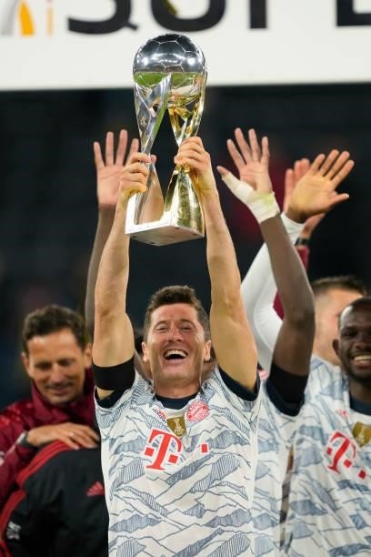 Robert Lewandowski of Bayern Muenchen lifts the trophy after winning the Supercup 2021 match between Borussia Dortmund and FC Bayern Muenchen at...