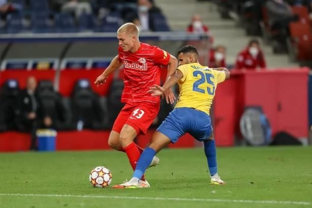 Rasmus Kristensen of Red Bull Salzburg and Anis Ben Slimane of Broendby IF battle for the ball during the UEFA Champions League Play-Offs Leg One...