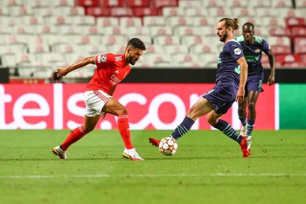 Goncalo Ramos of SL Benfica tries to escape Davy Propper of PSV Eindhoven during the UEFA Champions League Play-Offs Leg One match between SL Benfica...
