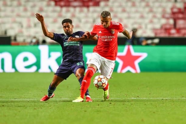 Philipp Mwene of PSV Eindhoven vies with Everton Cebolinha of SL Benfica during the UEFA Champions League Play-Offs Leg One match between SL Benfica...